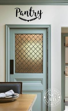 an entry door with the name pantry on it and a decorative glass window behind it