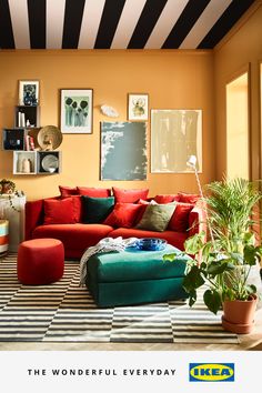 a living room filled with lots of furniture and decor on top of a checkered floor