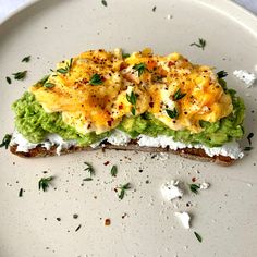 an open face sandwich with eggs and avocado