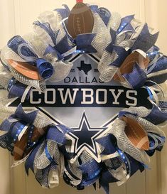 a football wreath with the word cowboys on it