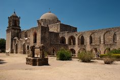 an old stone building with two towers