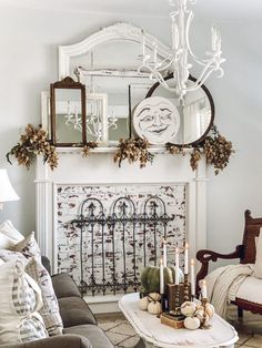 a living room filled with furniture and a mirror on the wall over a fire place