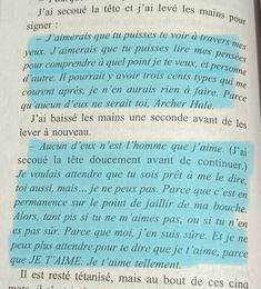 an open book with blue writing on the page and some words written in french above it