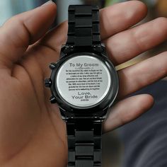 a person holding a watch with the words to my groom on it's face