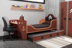 a child's bedroom with a pirate bed and desk in the corner is shown