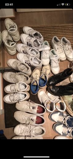 there are many pairs of shoes on the floor