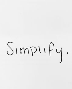 the word simpufy written in black ink on a white paper with an erase pen