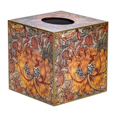 an artisticly designed tissue box with flowers on it