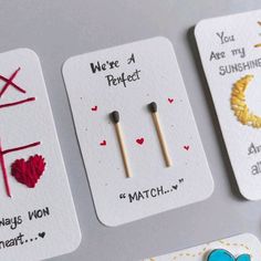 four different valentine's day cards with pins on them