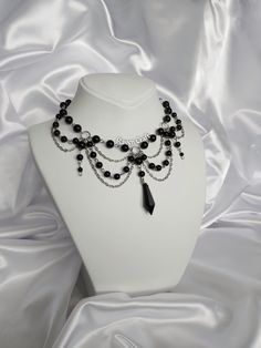 "Black Pearl Necklace, Gothic Jewelry, Witchy Choker, Unique Layered Necklace. Designed and made by me. 😺 All my designs are handmade. You can contact me for personalization. 🤍 - Pearl beads are glass. Black pendant is acrylic. - Necklace length is 40-41 cm / 16\" and adjustable.  - Stainless, nickel free. High quality brass material.  - I dont use any animal products such as real pearls or leather in my products. Totally vegan. - And also I use 100% recyclable packaging materials. You can message me here (Etsy messages) and on my Instagram account @Raven.Craft.Y with your requests, questions, ask for help or personalization. - To check my all models, you can visit my page 🖤 https://www.etsy.com/shop/RavenCraftByYesim" Gothic Chokers Collars, Black Layered Necklace, Dark Fairy Necklace, Gothic Beaded Jewelry, Gothic Beaded Necklace, Gothic Accessories Jewellery, Dark Accessories, Gothic Jewelry Diy, Witch Accessories