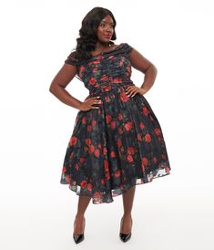 This stunning 1950s plus size piece features a charming off-the-shoulder neckline that beautifully frames your shoulders, while the ruched bodice hugs you in all the right places. Adorned with striking red roses against a classic black background, this dress is perfect for making a statement at any soirée. The flowing chiffon fabric allows for graceful movement and the drape in the back adds an extra touch of sophistication..Available in sizes XS-5X while supplies last. | Unique Vintage Plus Size 1950S Black & Red Rose Off The Shoulder Cocktail Dress | Size 4X/22-24 Off The Shoulder Cocktail Dress, Ruffle Cocktail Dress, Black Red Rose, Black And Red Roses, Vintage Plus Size, 1950s Style, Ruched Bodice, 1950s Fashion, Black Cocktail Dress