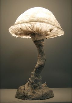 a white mushroom sitting on top of a table