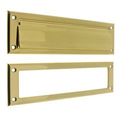 two brass door handles on a white background