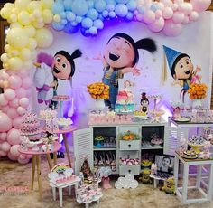 an image of a birthday party with balloons and cake table set up for children's birthday