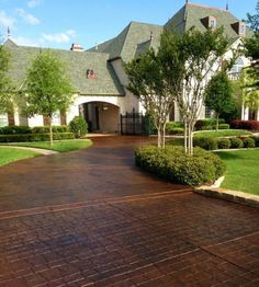 a driveway in front of a large house