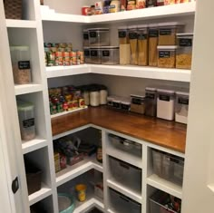 an organized pantry with lots of food in the shelves and bins on each side