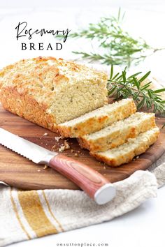 a loaf of rosemary bread sitting on top of a cutting board