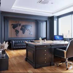 an office with a large desk and leather couches