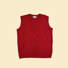 Vintage women's solid red sweater vest, manufactured ca. 1980s by Bedford Fair Lifestyles. Knit vest with button down closures, a deep v-neck, and a subtle geometric textured pattern. Size 1X.   - Time Period: c. 1980s  - Brand: Bedford Fair Lifestyles  - Size: 1X  - Colors: Red  - Materials: 100% acrylic  - Made in: Not listed  - Condition: In fair, vintage condition with pilling and surface fraying throughout. Please see the close-up photos and let us know if any additional details would be helpful.   Measurements:   - Armpit to armpit: 25"  - Shoulder: 18"  - Length: 28.75"  - Sleeve: 0" Note: our measurements are taken with clothing laid flat. We do not double for circumference on horizontal measurements.  We offer free shipping within the United States for all orders over $35, and shi Red Sweater Vest, Sweater Vest Vintage, Sleeveless Jumper, Sweater Vest Women, Solid Red, Red Sweater, Time Period, Knitting Women, Sleeveless Sweater