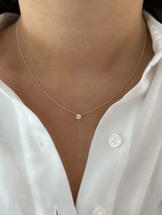 LeMel is known for its dainty gold jewelry and dainty gold necklaces! A timeless necklace you never have to take off! This round diamond necklace is dainty and perfect for layering and gives the illusion of a floating diamond necklace. For a simple and classic look wear this necklace on its own. We love to layer it with a paperclip chain necklace! Minimal Diamond Necklace, Minimalist Accessories Jewellery, Girly Necklace, Minimalist Diamond Necklace, Round Diamond Necklace, Timeless Necklace, Floating Diamond Necklace, Royalty Fashion, Dainty Gold Jewelry