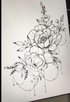 a black and white drawing of flowers on paper