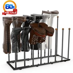 there are many pairs of boots in the rack on this white background with big sale sign above it