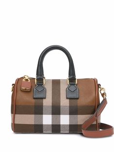 Find BURBERRY House Check Bowling Bag on Editorialist. This Burberry bowling bag features a house check pattern, top zip fastening, padlock detail, hanging key fob, two rounded top handles, detachable shoulder strap, full lining, and gold-tone hardware. The bag is made of a cotton blend and calf leather. Mini Bowling, Bowling Bag, Leather Roll, Bowling Bags, Cute Nike Shoes, Cute Nike, Cute Nikes, Burberry Handbags, Bag Charms