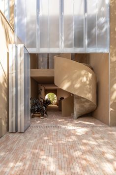 an entrance to a building with a spiral staircase