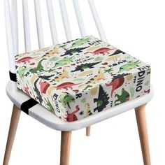 a white chair with a colorful seat cover on it