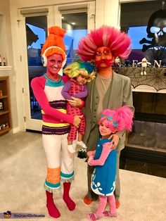 the family is dressed up in costumes for halloween