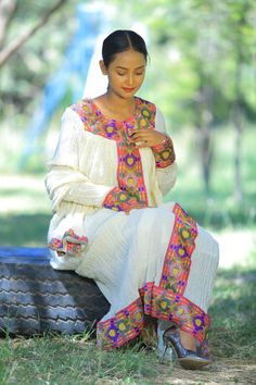 √ 100% Handmade √ 100% Cotton made √ it looks so cute when you wear it √ Very comfortable √ its made very carefully √ A very ideal gift to give √ Ethiopian dress √ 55 inchs Long(Shoulder to Bottom) and from shoulder to shoulder 15 Inches. Ethiopian long dress, Ethiopian Clothing, Ethiopian Cultural dress, Habesha Dress, Ethiopian Cultural Dress, Hager Libs, Abelfashion, Ethiopian gift, Eritrean Dress, Eritrean gift, Eritrea, Black Friday Sale, Ethiopian Fashion, Habesha Fashion, Ethiopian dress, Multicolor Dresses With Traditional Patterns For Summer, Multicolor Summer Dresses With Traditional Patterns, Long Dresses With Woven Motifs, Long Sleeve Matching Set Dresses For Summer, Long Sleeve Summer Dresses Matching Set, Summer Long Sleeve Dresses Matching Set, Summer Long Sleeve Dresses With Matching Set, Cotton Dresses With Traditional Patterns For Festival, Traditional Long Beige Dress