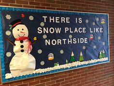 there is a snow place like northside sign on the wall in front of a brick building