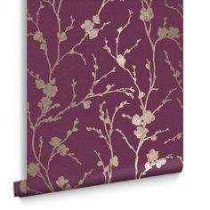 a purple wallpaper with gold flowers on it