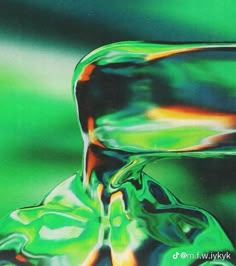 an abstract photograph of a green and red liquid