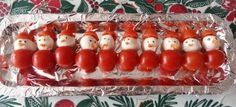 some kind of food that is wrapped in tin foil with santa clause and snowmen on it