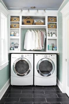 a washer and dryer in a laundry room with open shelving above them