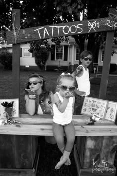 black and white photograph of people sitting at a bar