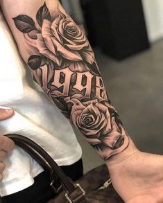 a person with a rose tattoo on their arm