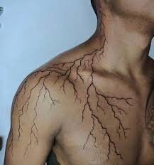 an image of a man's back with lightning signs on his body and chest