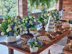 a table topped with lots of cakes and desserts