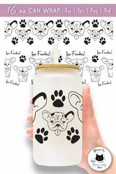 a hand holding a can with an image of a dog's paw on it