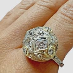 14kt White And Yellow Gold Vintage European Cut Diamond Dome Ring. There Are Two 3.5mm Old Euro Cut Diamonds And 19 Other Old Euro Cut Diamonds On The Ring. The Ring Is Approximately 0.54ctw Of Diamonds (Estimated In Ring). All Diamonds Are Estimated To Be Vs2-Si1 In Clarity And G-H In Color. The Sphere Of The Ring Measures Approximately 15mm In Diameter And Is Raised Approximately 4.59mm High. This Is An Elegant Vintage Engagement Ring Or Cocktail Ring. The Ring Is Size 7.75 And Weighs 4.1grams White 14k Gold Cluster Ring With Single Cut Diamonds, Platinum Jewelry With Single Cut Diamonds In Gold, Platinum Jewelry With Gold Single Cut Diamonds, Gold Platinum Jewelry With Single Cut Diamonds, Yellow Gold Filigree Ring With Diamond And Prong Setting, Yellow Diamond Round Anniversary Ring, Yellow Diamond Round Ring For Anniversary, Luxury Filigree Ring With Single Cut Diamonds, Yellow Gold Filigree Ring With Single Cut Diamonds