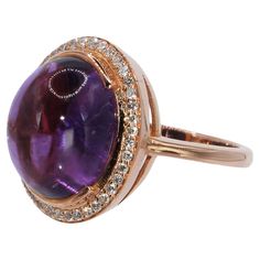 Amethyst Purple Oval Cabochon Cut Ring with pave Diamonds in 18 Carat Rose Gold The central stone is an Amethyst 8.53ct surrounded by brilliant cut pave diamonds 0.28ct A delicate and stylish piece of jewelry, a statement ring in vintage style wearable with an unusual but very fine and beautiful combination of stones, color of gold and cut of stone. Nicofilimon, as a jewelry designer has this special ability to combine stones, cuts and styles in its own way, leading his creations in a glam result that win the admiring glances and comments too. Every one of his jewelry is the beginning of a story. This really unique piece belongs to Metalloplasies Collection fragments of creativity, representing all different paths Nicofilimon has walked on during his career. This ring is an enduring emblem Princess Jewelry, Cabochon Ring, Amethyst Purple, Jewelry Designer, Oval Cabochon, Pave Diamonds, Statement Ring, Rose Cut, Diamond Rings