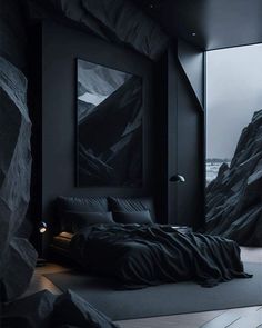 a bedroom with black walls and mountains in the background