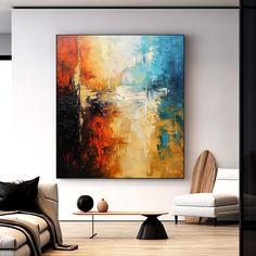 an abstract painting hangs on the wall in a modern living room