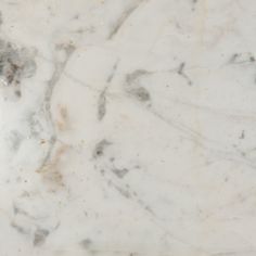 the marble is white and brown with gold flecks on it's edges