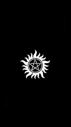 a black background with a white pentagramil in the center and sun above it