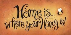 a sign that says home is where your honey is