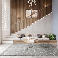 a living room filled with furniture and a chandelier hanging from the ceiling above it