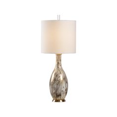 a table lamp with a white shade on it's base and a light bulb in the middle